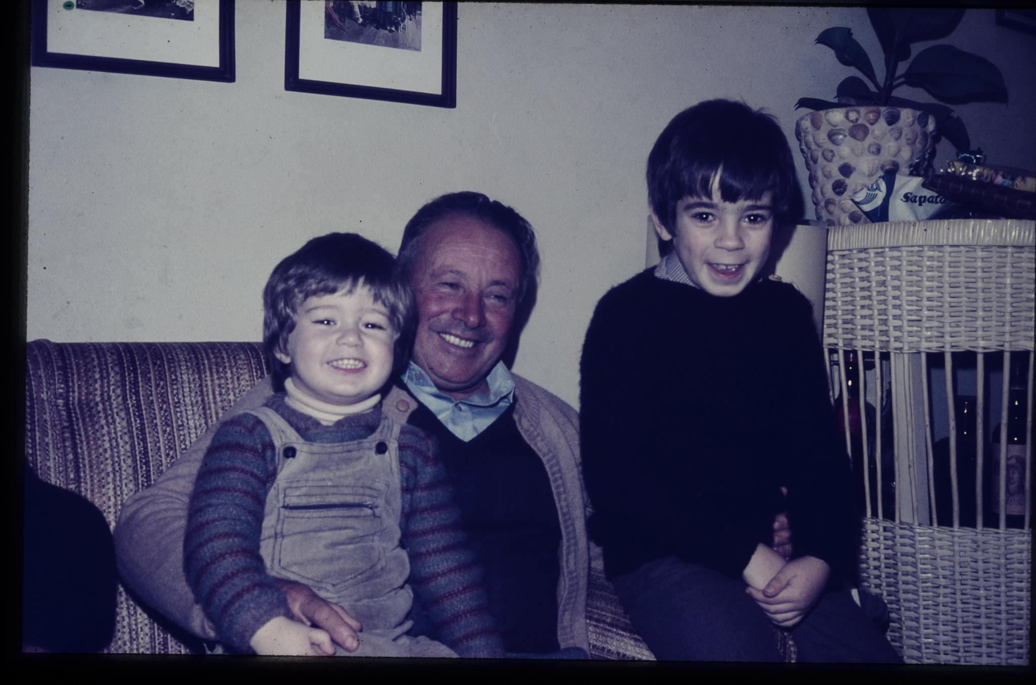 My grandfather's smile, with me at his right and my brother to his left